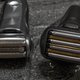 The Panasonic Arc6 razor next to a Braun Series 7 razor.